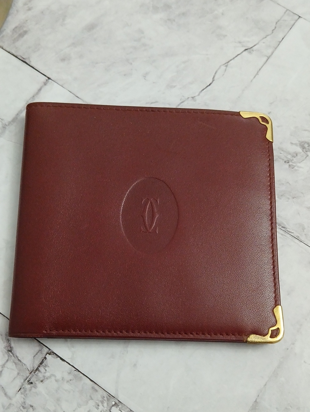 Cartier Burgundy Leather Bifold Wallet with Gold Corners
